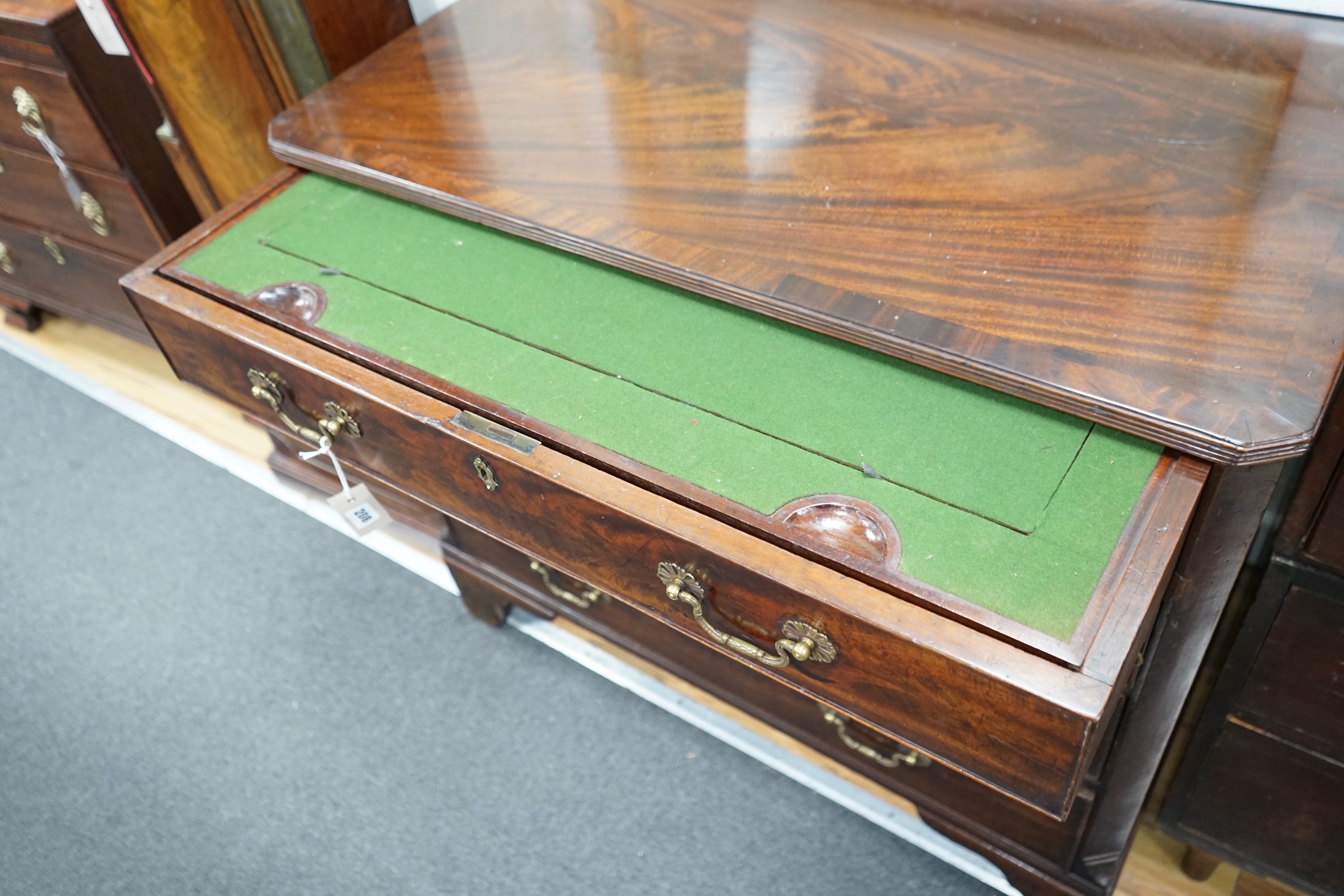 A George III and later mahogany dressing chest, the compartmented top drawer with sliding baize surface, width 98cm, depth 56cm, height 85cm *Please note the sale commences at 9am.
